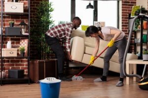 Multiracial couple doing spring cleaning